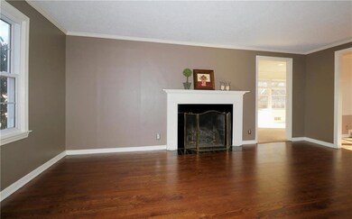 Living room looking into family room/den