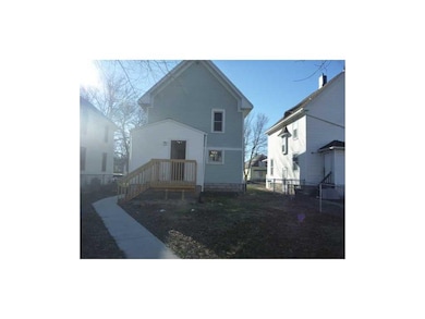 Exterior Back. Large fenced yard, concrete walk to