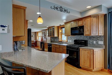 Maple cabinets and distinctive tile backsplash.