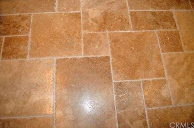 Chiseled travertine floor in kitchen.