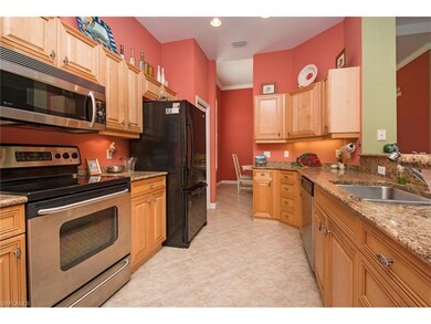 The updated kitchen features solid honey cabinets,