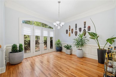 Don't you just love the french doors and light wel