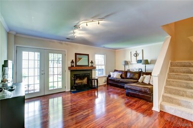Spacious living room with wood burning fireplace and abundant natural light