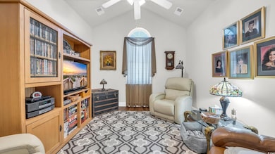 Living area featuring lofted ceiling and light wood finished floors