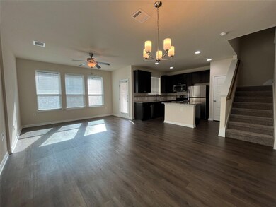 Unfurnished living room with a chandelier, a ceil