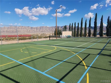 View of tennis/pickleball/basketball court featuri