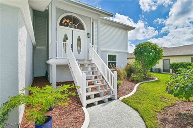 Property entrance featuring central AC unit and a