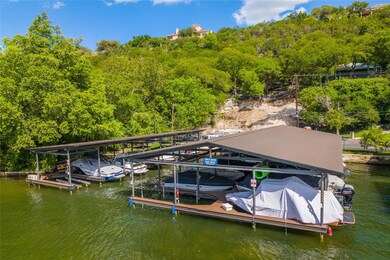 Dock with boat lift and a forest view