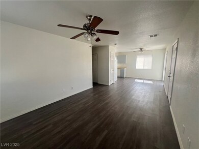 Unfurnished living room with dark wood-style floor