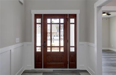 Entrance foyer featuring hardwood / wood-style flo
