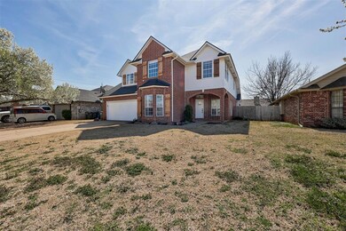 View of property with a front yard