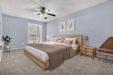 Staged image of the primary bedroom.