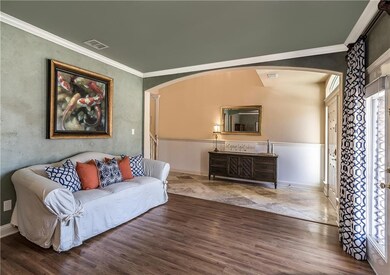 Formal living area with laminate wood flooring, cr