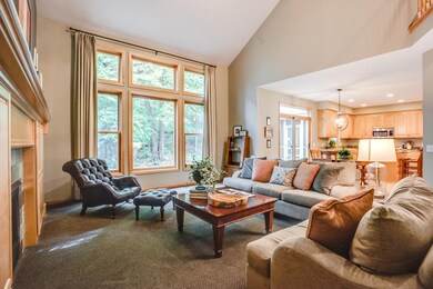 floor to ceiling windows overlook private yard