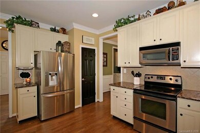 Granite counters, tile backsplash, stainless steel