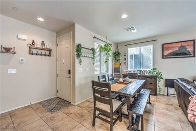 Dining area featuring baseboards and recessed ligh