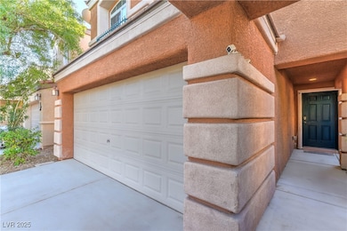 Garage featuring driveway
