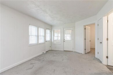 This home has matching wood blinds throughout.