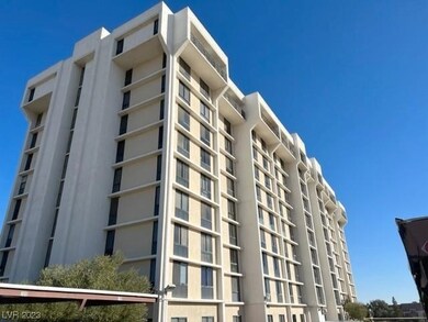 High rise condo building adjacent to strip.
