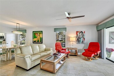 Living room with ceiling fan and a healthy amount 
