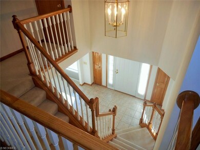 Two story foyer with ceramic tile floors.