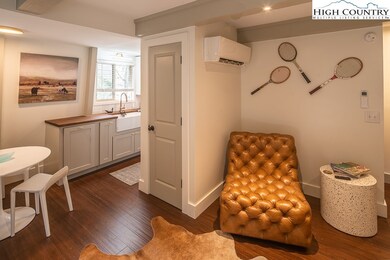 Photo shows entry to kitchen and part of dining an
