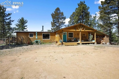 Cabin featuring log veneer siding