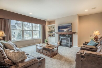 Large family room with wall of windows and beautif