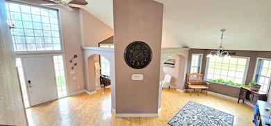 2 story view of main flr entryway/poss dining/sitting rm