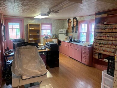 Original kitchen area with door leading to side en