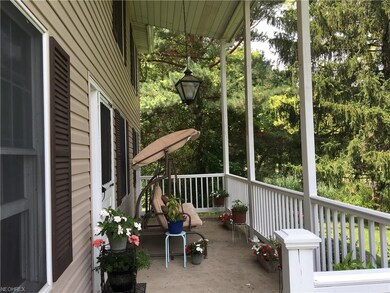 Welcoming front porch with clean lines and tall pi