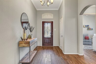 A beautiful glass front door opens into the inviting bright entry.
