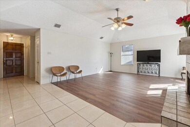 Unfurnished living room featuring a textured ceili