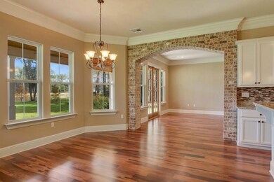 Spacious breakfast dining area with view of backya