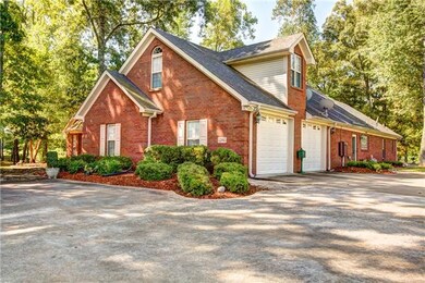 Side view of home with oversized 2 cat attached garages.