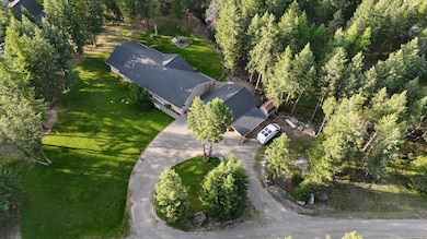 Bird’s-eye perspective highlights the pristine condition of the home and landscaped property