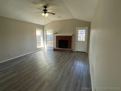 Expansive living room with cozy fireplace and high