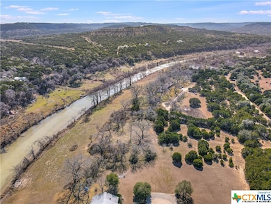This image shows the distinct zones of the property with the river on the left lined with cypress trees. Moving right you see the strip of meadow that leads up to the band of pecan trees in the middle. Further right you see selectively cleared ash junipers (cedars) and to the far right you see the thick band of cedars that provides privacy from the roads to the west.