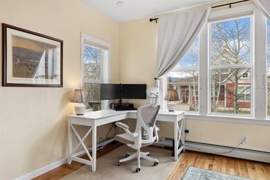 Office area with wood finished floors and baseboar