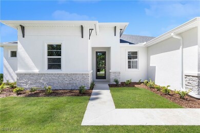 View of front of home with a front lawn, stone sid