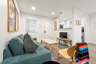 Living area with washer / clothes dryer and reces