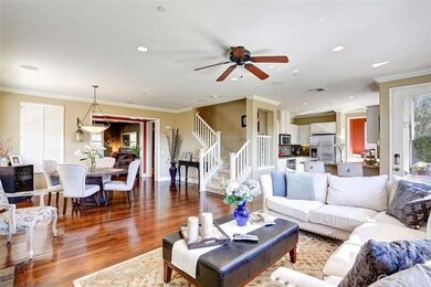 The living room flows seamlessly into the kitchen,