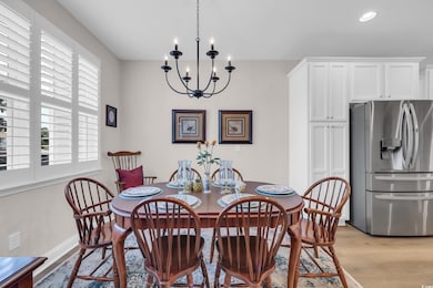 Dining space featuring a chandelier and light wood-style flooring