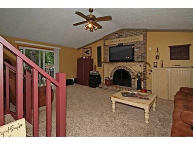 Living Room. Stairway in living room leads to seco