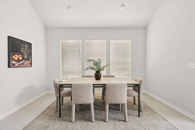 Dining area featuring baseboards and light colore