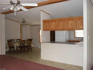 View from the Living room into the kitchen eating 