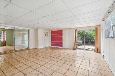 Large bonus room with sliding doors leading to the backyard