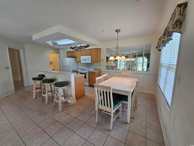 Dining room featuring light tile patterned floors and baseboards