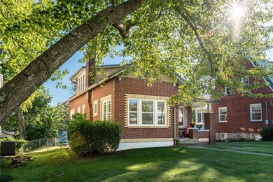 Mature trees give shade for this charming home!