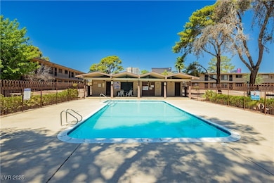 Community pool featuring a patio